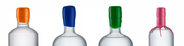 Four bottles, sealed with orange, blue, green and pink wax.