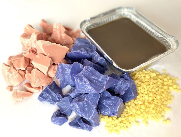 Waxes for depilatory applications, shown in chunks, pellets, and tray format.